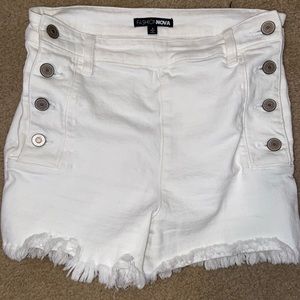 White denim shorts with buttons on the side